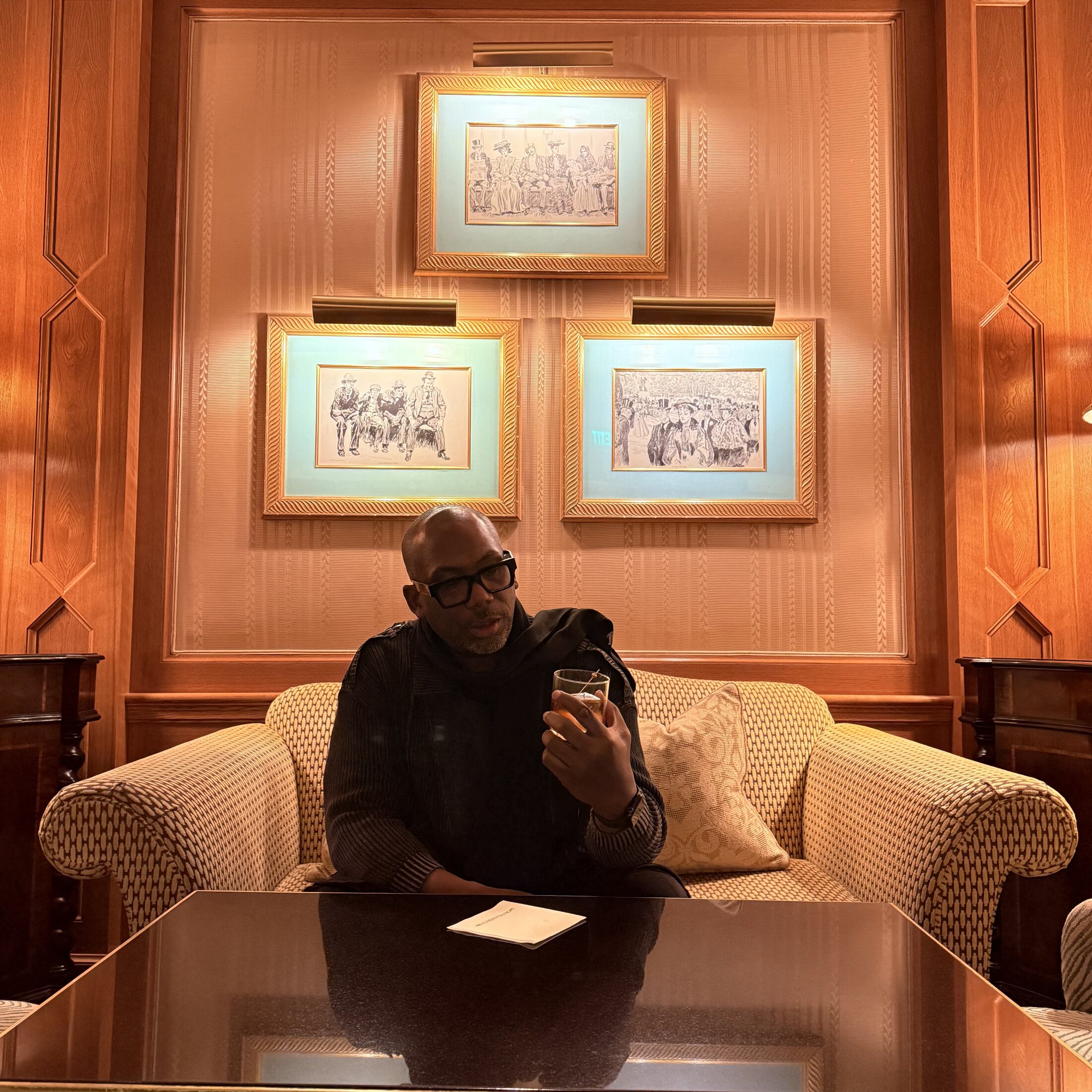 Christopher Burnam enjoying a hotel lounge