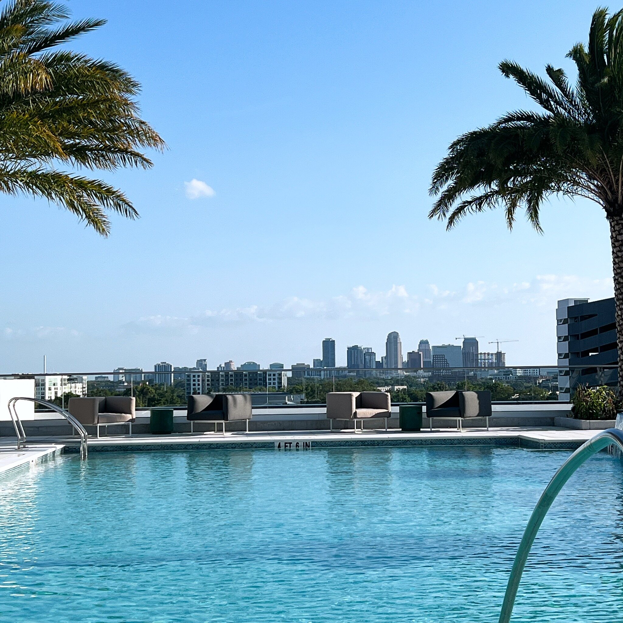 Rooftop hotel pool overlooking the Orlando skyline