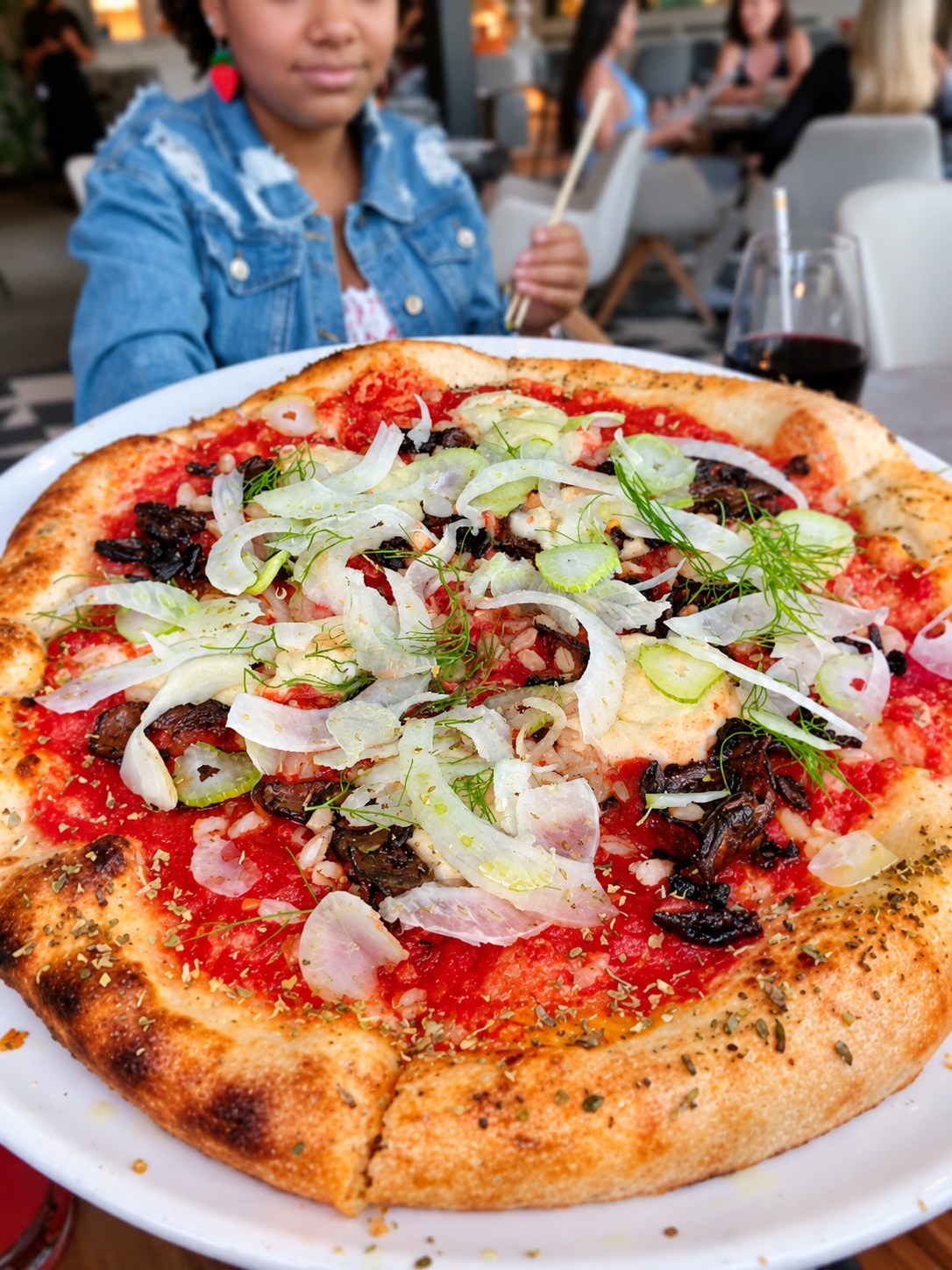 Vegan pizza served during a restaurant experience
